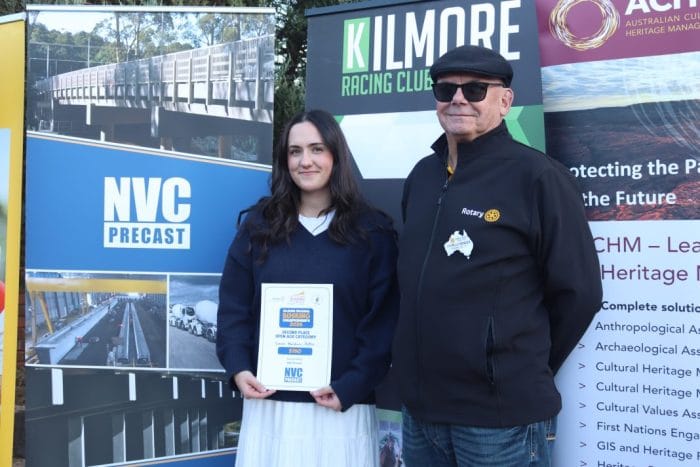 Busking Sarah Baldin Potton receives her prize money from Charles Bender